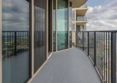 Microcement Solid Color and Textured Finishes on Balcony in Light Grey color.
