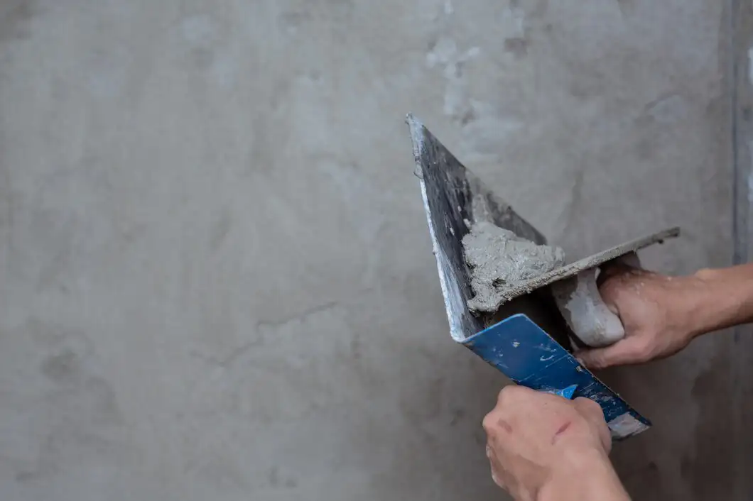 worker applying microcement