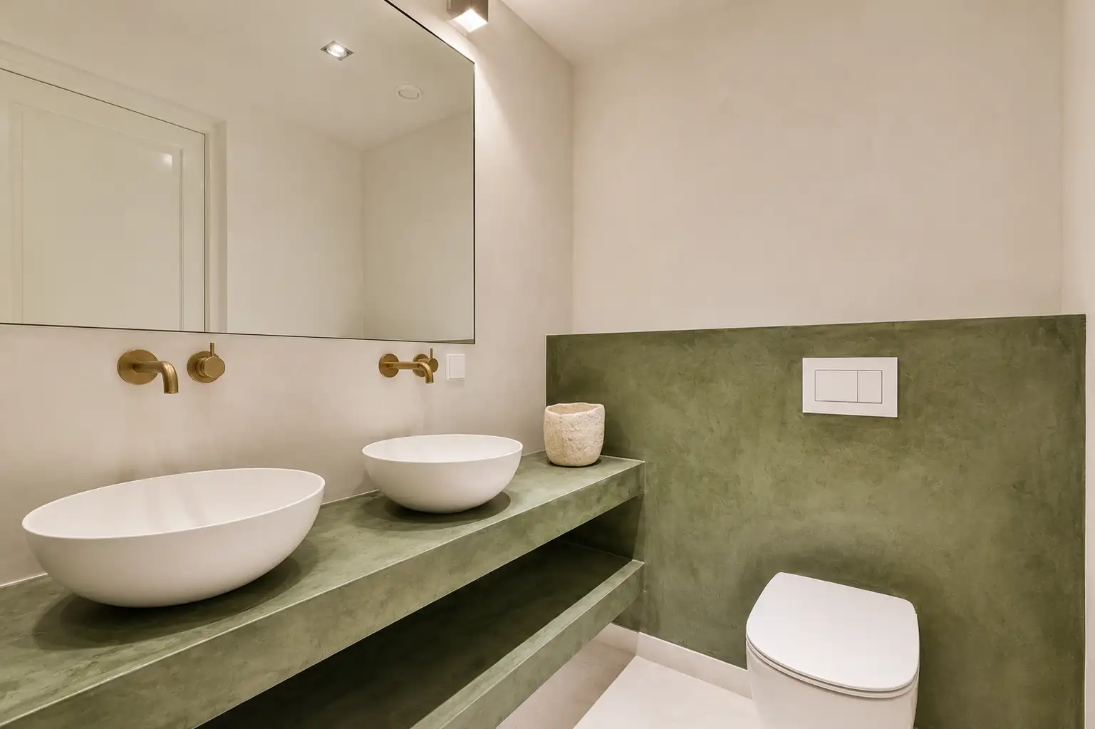 Modern green microcement bathroom interior